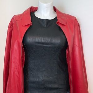 Has a zipper on the side, Bright red color.